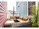 Outdoor seating area featuring comfortable cushioned furniture and a privacy screen; perfect for relaxation at 2017 Rhettsbury St, Carmel, IN 46032