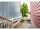 Outdoor side yard featuring a brick walkway, garden, and access to a charming white picket fence at 2017 Rhettsbury St, Carmel, IN 46032