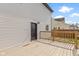 View of a house and backyard featuring a black door, window, and wooden deck at 2111 S A St, Elwood, IN 46036