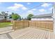 Open wooden deck with a wooden fence, offering ample outdoor space and privacy at 2111 S A St, Elwood, IN 46036