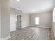 Spacious bedroom featuring wood-look flooring, neutral paint, recessed lighting and a closet with access to additional rooms at 2111 S A St, Elwood, IN 46036