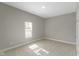 Empty bedroom features fresh carpeting and neutral paint, awaiting personalization at 2111 S A St, Elwood, IN 46036