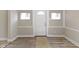 Inviting entryway featuring wood-look floors and ample natural light at 2111 S A St, Elwood, IN 46036