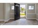Inviting entryway featuring wood-look floors and ample natural light at 2111 S A St, Elwood, IN 46036