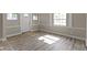 Inviting living space featuring wood-look floors and lots of natural light at 2111 S A St, Elwood, IN 46036
