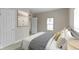 Comfortable main bedroom featuring a stylish bed and convenient access to the en-suite bathroom at 2111 S A St, Elwood, IN 46036