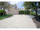 Long driveway leads to a spacious three-car garage, enhancing the home's curb appeal at 2223 Shaftesbury Rd, Carmel, IN 46032