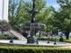 Beautiful tiered fountain near the West Clay Town Hall surrounded by lush landscaping at 2223 Shaftesbury Rd, Carmel, IN 46032
