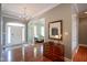 Spacious foyer with hardwood floors, chandelier, and views to the living spaces at 2223 Shaftesbury Rd, Carmel, IN 46032
