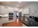 Spacious kitchen boasts stainless steel appliances, granite countertops, and ample cabinet space at 2223 Shaftesbury Rd, Carmel, IN 46032