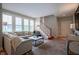 Cozy living room with large windows, a comfortable sofa, and elegant decor at 2223 Shaftesbury Rd, Carmel, IN 46032