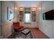 Inviting living room features custom built-ins, large window, stylish decor, and comfortable seating at 2223 Shaftesbury Rd, Carmel, IN 46032