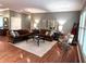 Cozy living room features hardwood floors, neutral paint, and comfortable seating at 2223 Shaftesbury Rd, Carmel, IN 46032