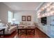 Cozy living room with hardwood floors, built-in shelving, and comfortable seating at 2223 Shaftesbury Rd, Carmel, IN 46032