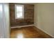 Cozy bedroom with hardwood floors and a feature wall at 229 Arnold St, Morgantown, IN 46160