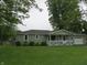 Quaint single-story home with a lovely front yard and attached garage at 229 Arnold St, Morgantown, IN 46160