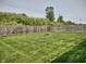 Spacious backyard with a well maintained lawn and fire pit at 2432 Bridlewood Dr, Franklin, IN 46131