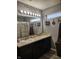 Bathroom featuring a double sink vanity with Hollywood-style lighting at 2432 Bridlewood Dr, Franklin, IN 46131