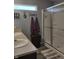 Well-lit bathroom featuring a double sink vanity, modern fixtures, and a glass-enclosed shower at 2432 Bridlewood Dr, Franklin, IN 46131