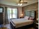 This bedroom features a decorative accent wall and a lighted ceiling fan at 2432 Bridlewood Dr, Franklin, IN 46131