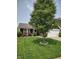 Charming single-story home featuring a lush front yard, colorful roses, and a two-car garage at 2432 Bridlewood Dr, Franklin, IN 46131