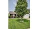 Traditional home featuring a manicured lawn and a two-car garage, complemented by a mature shade tree at 2432 Bridlewood Dr, Franklin, IN 46131