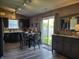Well-lit eat-in kitchen featuring modern cabinetry, a dining table, and a sliding glass door at 2432 Bridlewood Dr, Franklin, IN 46131