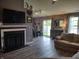 Open-concept living area seamlessly integrates a cozy sitting area with the modern kitchen at 2432 Bridlewood Dr, Franklin, IN 46131