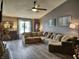 Inviting living room features a large sectional sofa, vaulted ceilings, and hardwood floors at 2432 Bridlewood Dr, Franklin, IN 46131