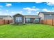 Backyard with well-kept lawn, patio area, privacy fence and gray siding at 2538 Bridlewood Dr, Franklin, IN 46131
