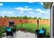 A backyard view highlighting a grill, lush lawn, and privacy fence at 2538 Bridlewood Dr, Franklin, IN 46131