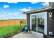 A backyard view featuring a patio and well-maintained green lawn with a wood fence at 2538 Bridlewood Dr, Franklin, IN 46131
