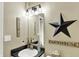 Charming half bathroom with unique vanity and decorative mirror at 2538 Bridlewood Dr, Franklin, IN 46131