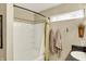 Bright bathroom featuring a tub with white tile surround and decorative window at 2538 Bridlewood Dr, Franklin, IN 46131