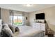 Bedroom with a large window offering a scenic outdoor view at 2538 Bridlewood Dr, Franklin, IN 46131