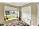 Bright bedroom features a window seat and neutral walls and has closet space at 2538 Bridlewood Dr, Franklin, IN 46131