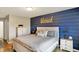 Cozy bedroom with shiplap accent wall and neutral decor at 2538 Bridlewood Dr, Franklin, IN 46131