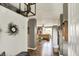 Hallway with stylish decor and views into the cozy living room and dining areas at 2538 Bridlewood Dr, Franklin, IN 46131