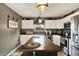 Charming kitchen featuring white cabinets, a center island, and stylish pendant lighting at 2538 Bridlewood Dr, Franklin, IN 46131