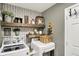 Functional laundry room featuring side-by-side washer and dryer with decorative shelving at 2538 Bridlewood Dr, Franklin, IN 46131