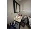 Bathroom featuring a sink with mirror and toiletries, plus a toilet and some exposed patching on the walls at 2627 Lincoln St, Anderson, IN 46016