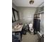 View of a bathroom with a single sink vanity, toilet, and shower with a curtain, showing signs of wear at 2627 Lincoln St, Anderson, IN 46016