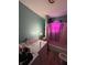 The bathroom features a toilet, shower/tub combination with shower curtain, and a washing machine, plus some patching on the walls at 2627 Lincoln St, Anderson, IN 46016
