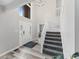 Bright foyer featuring a chandelier, a staircase, and a glass-paneled front door at 2871 Mullinix Rd, Greenwood, IN 46143