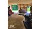 Image shows various motorized lawn equipment in the garage at 2871 Mullinix Rd, Greenwood, IN 46143