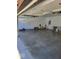 Open garage with a gray floor and garage door at 2871 Mullinix Rd, Greenwood, IN 46143