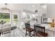 Open-concept kitchen and dining area with stainless appliances and bar seating at 2871 Mullinix Rd, Greenwood, IN 46143