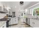 Bright kitchen with white cabinets, granite countertops and stainless appliances at 2871 Mullinix Rd, Greenwood, IN 46143