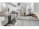 Eat-in kitchen featuring stainless appliances, granite countertops, white cabinets and wood floors at 2871 Mullinix Rd, Greenwood, IN 46143