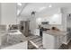 Bright, modern kitchen with stainless steel appliances, white cabinets and granite countertops at 2871 Mullinix Rd, Greenwood, IN 46143